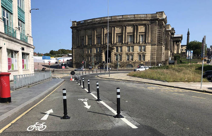 Asphalt anchors used to secure cycle lane separator bollards