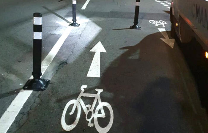 Asphalt anchors used to fix cycle lane separator bollards