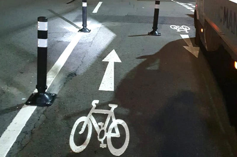 Asphalt anchors used to fix cycle lane separator bollards